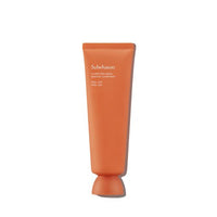 Matte orange tube of clarifying peel-off mask with simple white text on plain white background