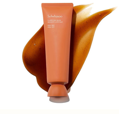Orange tube of clarifying peel-off mask shown with textured brown gel swatch on white background