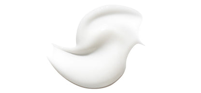 Smooth white serum texture with creamy consistency showcasing radiance-boosting skincare benefits