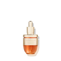 Compact gold and amber dropper bottle of revitalizing ampoule with collagen boosting benefits on white background