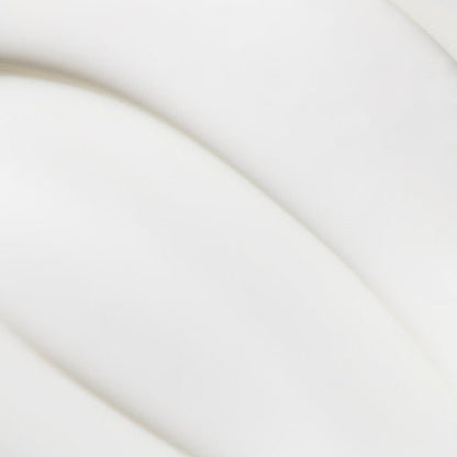 Smooth white cream texture with soft, radiant finish suggesting nourishing and anti-aging skincare benefits