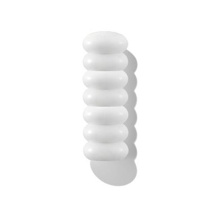 Smooth white balm swatch with creamy texture and soft shadow on white background symbolizing 24-hour hydration effect