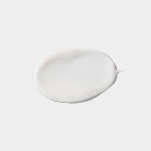 Smooth white emulsion cream texture sample showing lightweight hydration and moisture retention properties on pale background