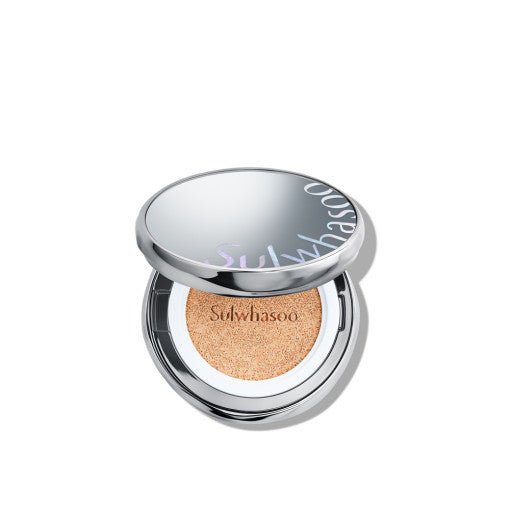 Open silver compact of cushion foundation with natural finish tinted sponge and subtle brand logo on lid