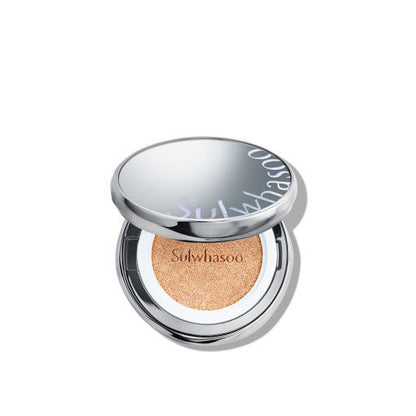 Open silver compact of cushion foundation with natural finish tinted sponge and subtle brand logo on lid