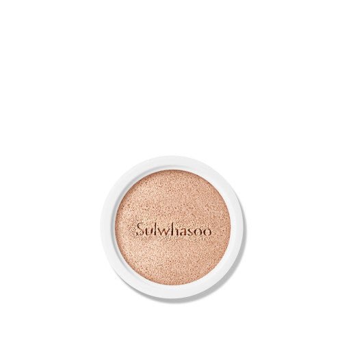 Close-up of a natural finish cushion foundation refill with smooth texture and subtle warm beige tone on white background