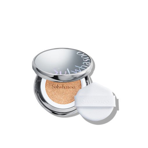 Open silver cushion compact with light beige radiant finish cushion and white applicator puff on white background