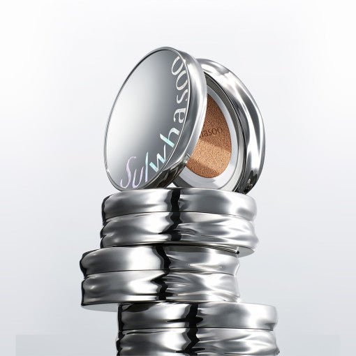 Stack of shiny silver cushion compacts with one open to reveal a radiant finish cushion inside