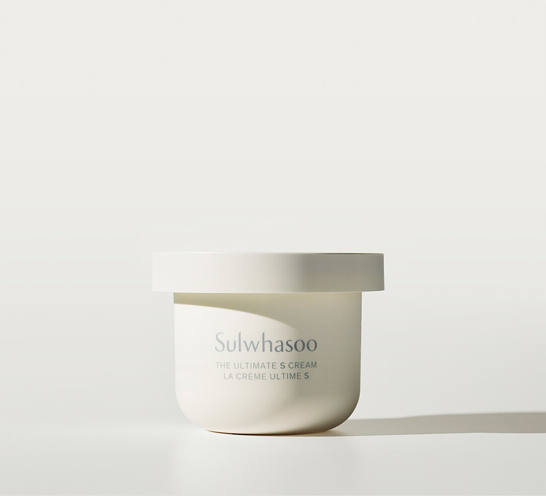 Minimalist white jar of nourishing cream with subtle branding, highlighting elasticity boost benefits on neutral background