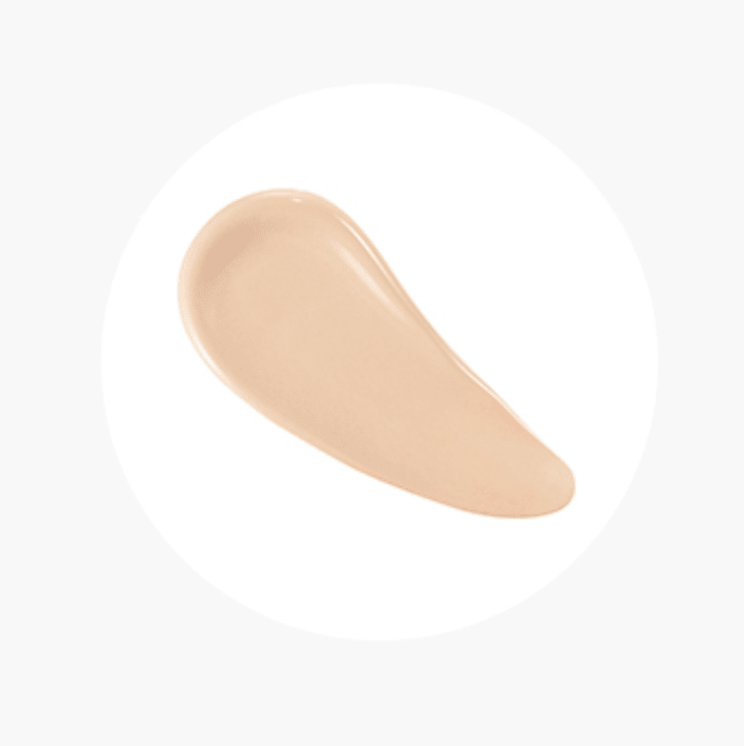 Beige tinted sun cream swatch showing smooth texture with broad spectrum SPF50+ protection benefits