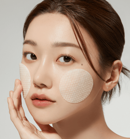 medicube Deep Vita C Pad 150g (70 Pads) applied on cheeks for brightening skincare effect on model's face