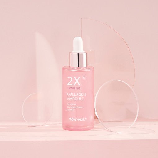 Pink glass dropper bottle of 2X collagen ampoule with silver cap promoting improved skin firmness on soft pink background