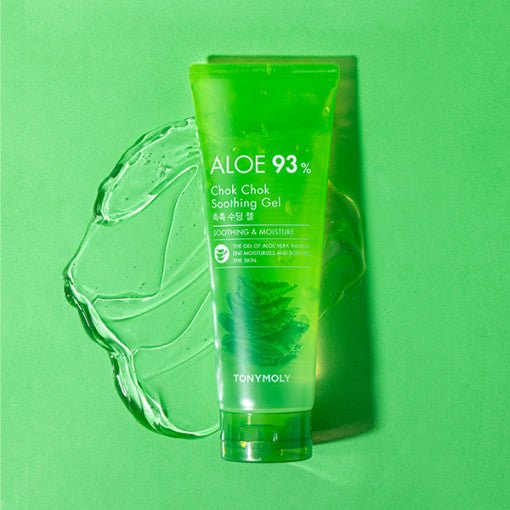 Green translucent tube of soothing aloe gel on matching green surface with gel smear behind emphasizing hydration benefits