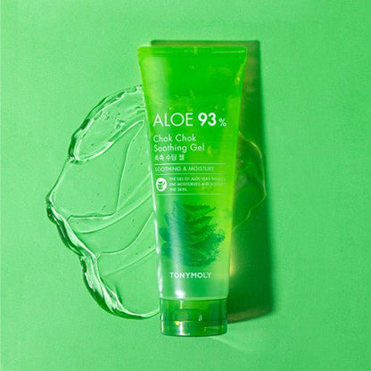 Green translucent tube of soothing aloe gel on matching green surface with gel smear behind emphasizing hydration benefits