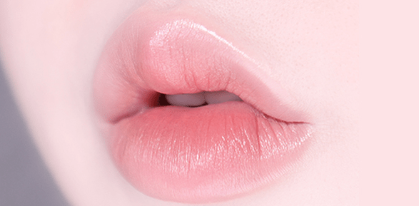 Soft close-up of lips with natural pink tint highlighting comfortable wear lip liner effect