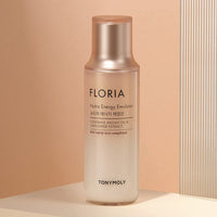 Tall frosted bottle of moisturizing emulsion with soft gold cap featuring argan oil and safflower extract benefits