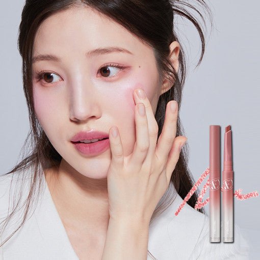 Young woman with natural makeup applying soft pink tint using a sleek dual-ended lip liner tool