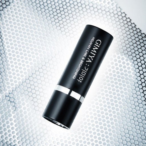 Sleek black ampoule stick designed for melanin care and brightening with freckle reduction benefits