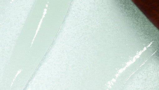 Close-up of transparent gel texture on white surface highlighting soothing and cooling skin benefits