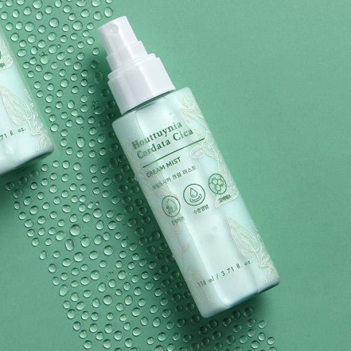 Light green bottle of soothing cream mist with botanical design highlighting calming skincare benefits on matching background