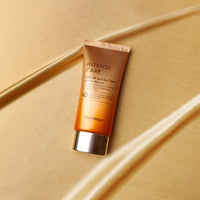 Tube of moisturizing sun cream in gold packaging with silver cap highlighting SPF50+ PA++++ protection benefits