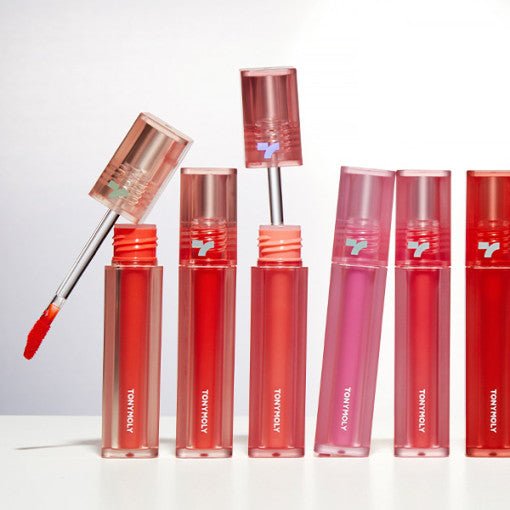 Set of vibrant lip colors in transparent tubes with applicator wands showcasing long-lasting tinted lip product benefits