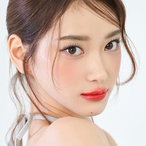Close-up of a woman with glossy, natural-looking lips wearing long-lasting red lip color from TONYMOLY PERFECT LIPS collection