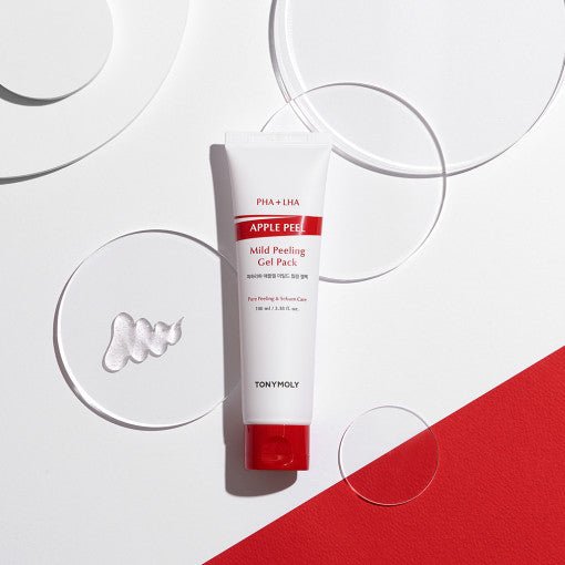 White and red tube of mild peeling gel with clear gel sample on white and red background featuring round acrylic props