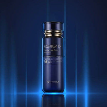 Dark blue bottle of brightening essence featuring gold accents and premium minimalist design on glowing blue background