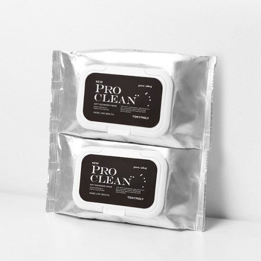 Two silver packets of soft cleansing tissues with black labels and white flip-top lids stacked on white surface