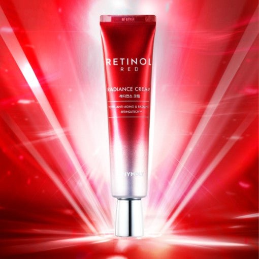 Red gradient tube of retinol radiance cream with silver cap glowing against vibrant radiant red background