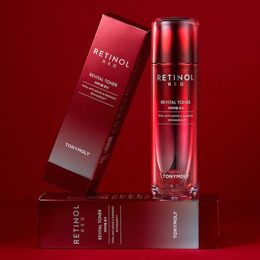 Red-tinted bottle of wrinkle-reducing revital toner with matching red packaging on a red surface and background