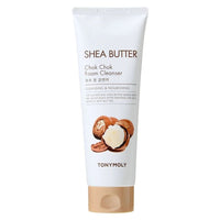 White tube of moisturizing foam cleanser featuring shea butter visuals and gold flip cap on plain background
