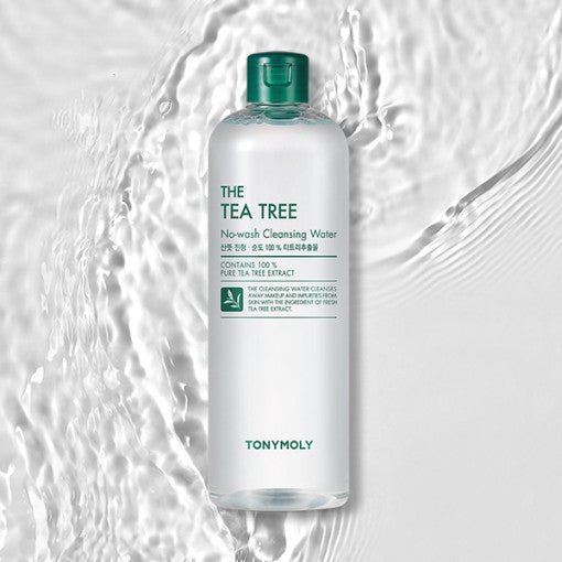 Clear bottle of tea tree no-wash cleansing water with green cap on textured rippled water surface background
