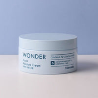 White jar of Wonder Aqua Moisture Cream highlighting 74% glacial water for hydration and soothing care on pale background