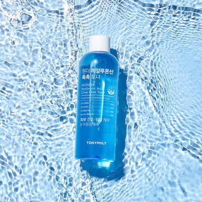 Blue toner bottle floating on clear rippling water surface highlighting hydration and refreshing care benefits