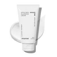 White tube of gentle cleansing cream with apple seed oil text on a smooth cream smear background