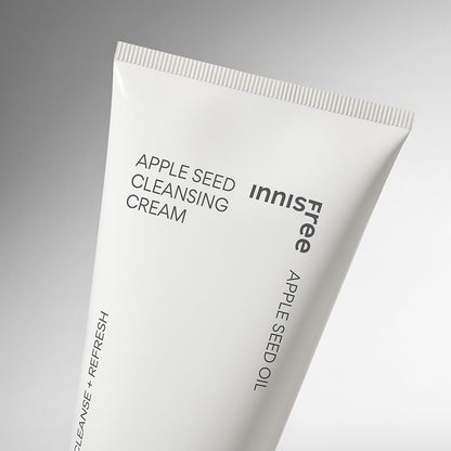 Minimalist white tube of gentle apple seed cleansing cream with clean black text on a soft gradient background
