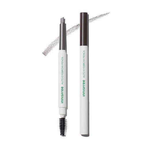 White and brown automatic eyebrow pencil with spoolie brush and angled tip showing soft gray stroke on white background