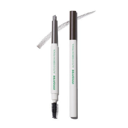 White and brown automatic eyebrow pencil with spoolie brush and angled tip showing soft gray stroke on white background
