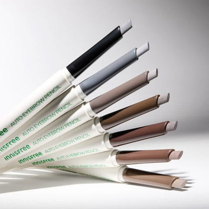 Six shades of automatic eyebrow pencils arranged diagonally, showcasing natural tones for subtle definition.