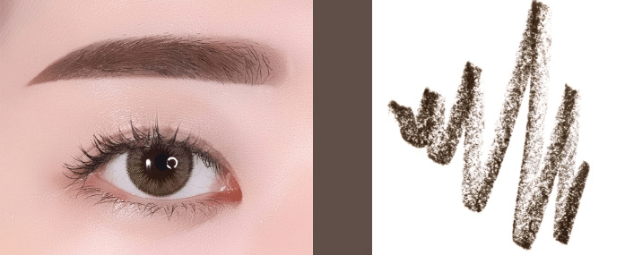 Close-up of natural-looking eyebrow enhanced with soft brown pencil strokes on a pale skin tone background