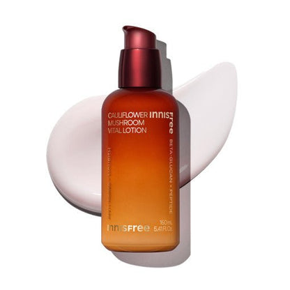 Amber gradient bottle of hydration lotion with pump cap and creamy swatch background highlighting intense moisture effect
