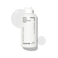 White bottle of mild peeling toner with clear liquid droplets on a bright white background highlighting exfoliation benefits