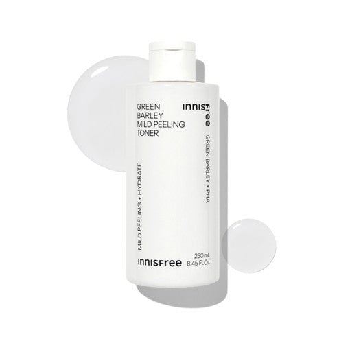 White bottle of mild peeling toner with clear liquid droplets on a bright white background highlighting exfoliation benefits