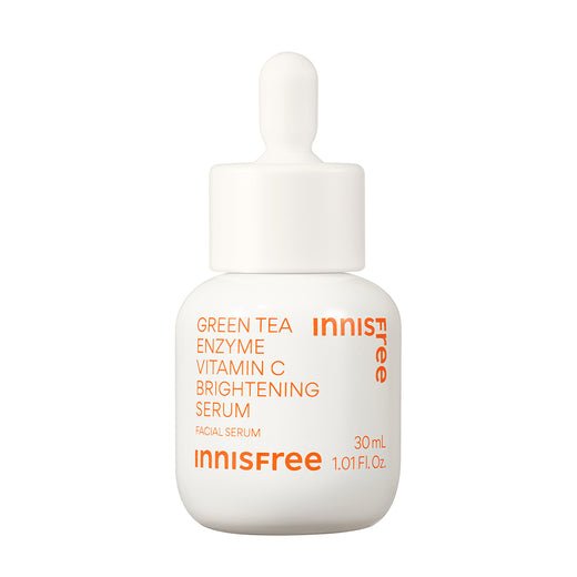 White dropper bottle featuring bright orange text highlighting green tea enzyme and vitamin C brightening serum benefits