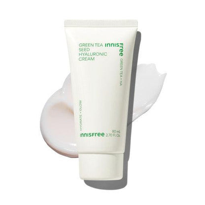 Minimalist white tube of moisturizing cream with green text, placed over smooth hydrating cream swatch on white background