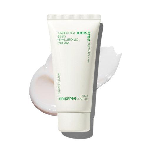 White tube of hydrating cream with green text placed on creamy white lotion smear background