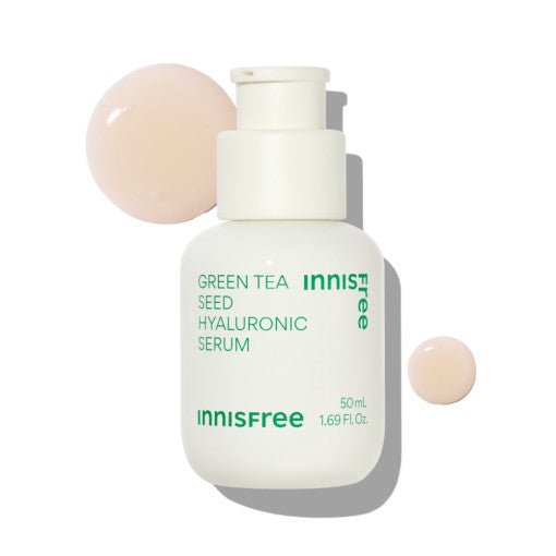 White bottle of hydrating serum with green text and two droplets of light beige serum on white background