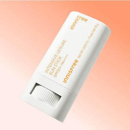 White sun protection stick with orange text for high SPF and PA++++ benefits on a soft peach background